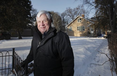 Photo of Tom Denton, head of Hospitality House, a church run organization that sponsors refugees - mostly African - into Winnipeg.  The home behind him is one of the homes they stay when they first arrive. Jan 17, 2012 (Ruth Bonneville /  Winnipeg Free Press)