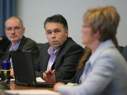 Brandon Sun Dean Hammond, left, and Scott Hildebrand listen as Mayor Shari Decter Hirst addressed the issues surrounding the budget debate during a news conference held at City Hall on Tuesday morning. (Bruce Bumstead/Brandon Sun)