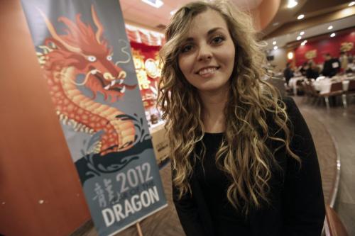January 24, 2012 - 120124  - Jessica Constable, Red River design student and designer of this banner to commemorate 21 years of dragon street banners at the Chinese New Year celebrations at the Kum Koon Garden Tuesday January 24, 2012.    John Woods / Winnipeg Free Press