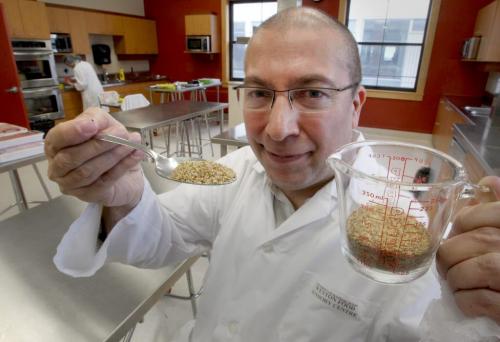 University of Manitoba professor Dr. Michel Aliani has a $160,000 research grant to develop a healthy flaxseed muffin without using fat or sugar- He holds in photograph 30 grams of flax seed that would be in one of his healthy muffins- See Nick Martin story January 25, 2012   (JOE BRYKSA / WINNIPEG FREE PRESS)