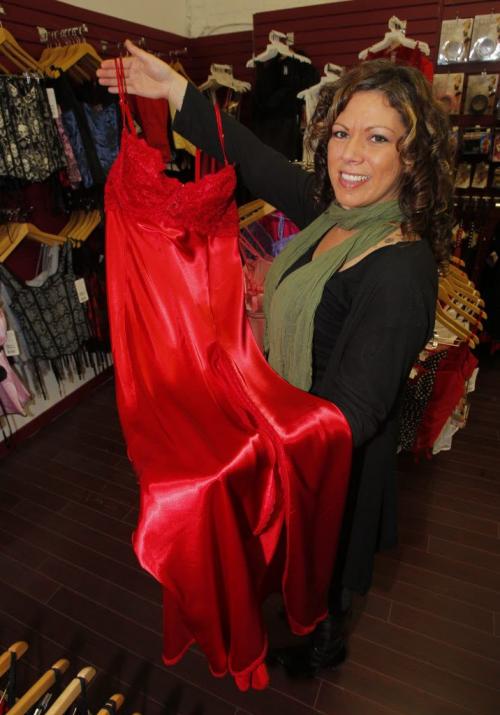 Fantasy Boutique, 88 Albert St., located underneath Mariaggi's theme suite hotel. Brenda Unger holding some red lingerie they sell in the shop. January 25, 2012 BORIS MINKEVICH / WINNIPEG FREE PRESS