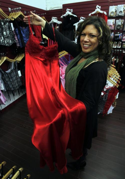 Fantasy Boutique, 88 Albert St., located underneath Mariaggi's theme suite hotel. Brenda Unger holding some red lingerie they sell in the shop. January 25, 2012 BORIS MINKEVICH / WINNIPEG FREE PRESS