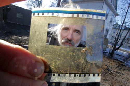 Ed Ackerman at his property where he stood on the roof in protest on Bannatyne. He holds a peice of film from one of his animation movies. It was in the rubble and he picked it up off the ground.  January 26, 2012 BORIS MINKEVICH / WINNIPEG FREE PRESS