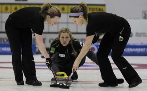Skip Cathy Overton-Clapham flanked by Ashley Howard (left) and Breanne Meakin (right) throws a rock during the Friday afternoon draw against Team Carey in the Scotties Tournament of Hearts at the Portage la Prairie PCU Centre.  120127 Mike Deal / Winnipeg Free Press