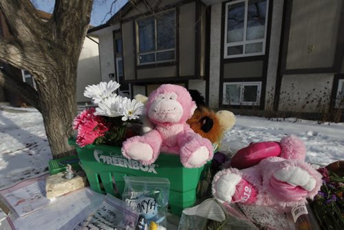 January 29, 2012 - 120129  -  On Sunday January 29, 2012 a memorial sits in the front garden of the home at 11 Woodlark Place which was the scene of a fire that killed five people.    John Woods / Winnipeg Free Press