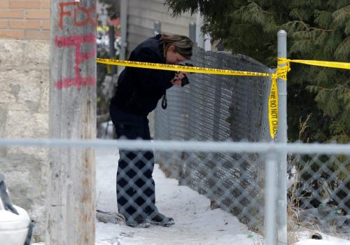 Winnipeg Police Service Identification unit member works at the scene of what is being called, as of 3:30, a sudden death. The address is 426 Maryland. The photo was taken on the south side of the building in the rear. Please refer to Gabrielle Giroday, who was at the scene as well. January 30, 2012 BORIS MINKEVICH / WINNIPEG FREE PRESS