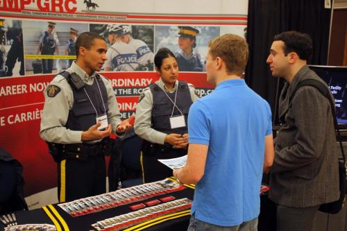 UNIVERSITY OF MANITOBA, 2ND FLOOR University Centre. Job fair for graduation faculty of education students. This is the RCMP booth. IDs RCMP- Cont. Ron Bumbry and Cont. Izza Mian. Students Dale Tanner and Gilli Braunstein. January 30, 2012 BORIS MINKEVICH / WINNIPEG FREE PRESS
