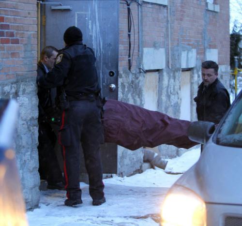 Winnipeg Police Service attended the scene of what is being called, as of 3:30, a sudden death. The address is 426 Maryland. The photo was taken looking at the back side of the building. In the photo is a crew, not cops, that removed the body and put it into a minivan out back. Please refer to Gabrielle Giroday, who was at the scene as well. January 30, 2012 BORIS MINKEVICH / WINNIPEG FREE PRESS