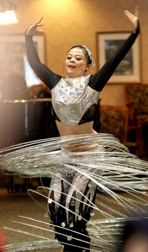 Hula Hoop acrobatic dancer with the Guizhou Acrobat Troupe from southwest China was just one of the many talented dancers that gave a sampling of their show at Shaftesbury Park Retirement Home Tuesday afternoon for Chinese New Year.  The full 2 hour performance can be seen at the Chinese New Year Celebrations at Pantages Playhouse Theatre Saturday evening. Jan 31, 2012 (Ruth Bonneville / Photographer) Winnipeg Free Press