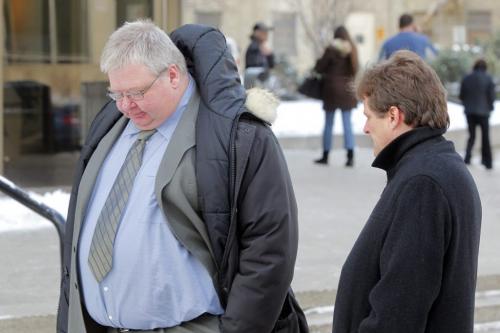 (left) Mark Stobbe, who's accused of beating his wife Beverly to death with a hatchet, out for a break from the trial. On right is FP reporter Bruce Owen. Photo taken in front of Law Courts buidling. REPORTER: Bruce Owen.  February 1, 2012 BORIS MINKEVICH / WINNIPEG FREE PRESS