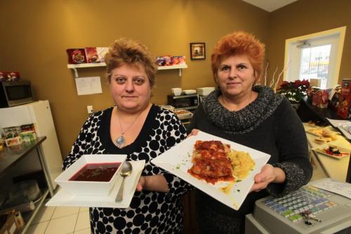 Joanna Dick (left) with her mother Lidia Kogutowicz (right) in their family run bistro, The Bend, on Corydon Avenue.  They are holding Borscht (left) and Cabbage Rolls (right).  See Marion Warhaft review  120201 Mike Deal / Winnipeg Free Press