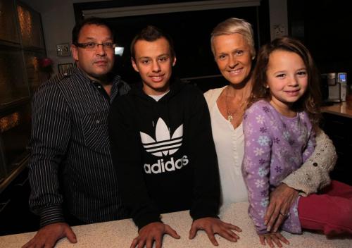 Aleksei Minarik, 13, with parents, Don (left), Alli (right) and little sister, Jerzy, 5. Aleksei, who has a form of childhood cancer called Ewing's Sarcoma, is going to the Super Bowl with his family to fulfill a dream. See Melissa Martin story  120201 Mike Deal / Winnipeg Free Press