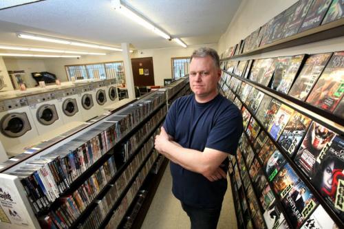 Ken Taylor with Video 1000 on Mountain Ave. has to offer his customers a vareity of options like laundry facilities to keep in business. See Randall King story. Feb 02, 2012 (Ruth Bonneville / Photographer) Winnipeg Free Press