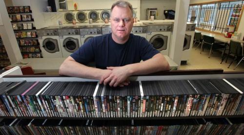 Ken Taylor with Video 1000 on Mountain Ave. has to offer his customers a vareity of options like laundry facilities to keep in business. See Randall King story. Feb 02, 2012 (Ruth Bonneville / Photographer) Winnipeg Free Press
