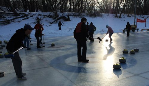 As the sun heads toward the horizon teams continue to compete in the 11th annual Ironman Outdoor Curling Bonspielon on the Assiniboine River at The Forks on Friday. The event runs until Sunday. 120204 Mike Deal / Winnipeg Free Press