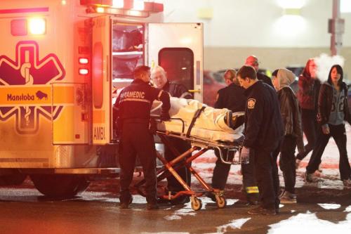 A 16-yr-old male is put into an ambulance after being hit by a vehicle while crossing St. James right beside the Silver City Polo Park movie theatres shortly before 8 P.M. No word on his condition.   120204 Mike Deal / Winnipeg Free Press