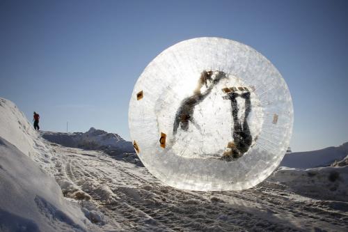 February 5, 2012 - 120205  -  Charlenn Skead and Adam Wowchuck roll down a hill in a Zorb at Adrenaline Adventures Sunday, February 5, 2012.  This was one of Skead's birthday presents from Wowchuck. John Woods / Winnipeg Free Press