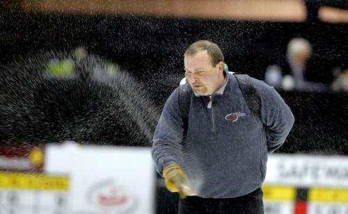 Safeway Select curling in Dauphin, Manitoba. Ice tech Greg Ewasko in photo pebbling. This is done before every game. Greg is one of the two people in charge of maintaining the ice in the curling event that started this morning. February 8, 2012 BORIS MINKEVICH / WINNIPEG FREE PRESS