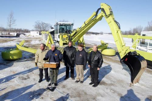 The new Amphibex AE400 at the news conference announcing it in East Selkirk, Manitoba. Left to right. Selkirk NDP MLA Greg Dewar, Manitoba Premier Greg Selenger, Peter Bjornson -MLA for Gimli, St. Andrews Reeve Don Forfar,  , and St. Clements Mayor Steve Strang, , and  February 10, 2012 BORIS MINKEVICH / WINNIPEG FREE PRESS