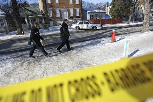Forensic investigators arrive to the 600 block of Simcoe Street, Sunday, February 12, 2012. A man was found lying on the street, and was transported to hospital in critical condition. He was later pronounced dead. (TREVOR HAGAN/WINNIPEG FREE PRESS) Winnipeg's 3rd homicide.
