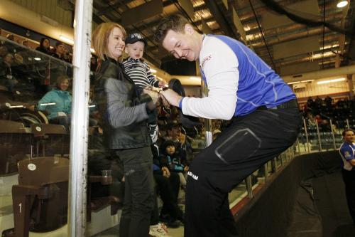 February 12, 2012 - 120212  -  Rob Fowler jumps up to celebrate his win in the Safeway Championship over Mike McEwen with wife Ericka and son Carson in Dauphin Sunday February 12, 2012.    John Woods / Winnipeg Free Press