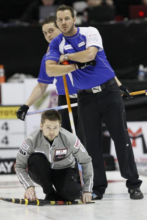 February 12, 2012 - 120212  -  Richard Daneault, 2nd for Rob Fowler and his lead Derek Samagalski look down ice as Mike McEwen curls in the Safeway Championship in Dauphin Sunday February 12, 2012.    John Woods / Winnipeg Free Press