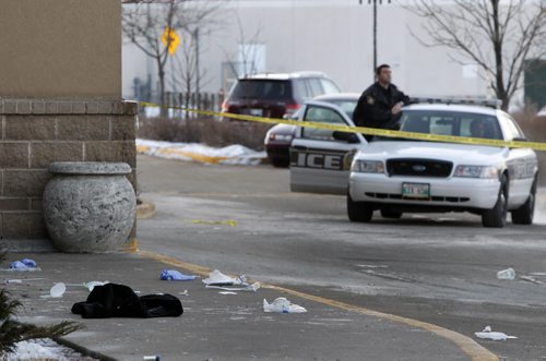 Winnipeg Police at the taped off scene in front of the Canad Inns Polo Park on St. Matthews Ave. Tuesday morning after a overnight stabbing. (WAYNE GLOWACKI/WINNIPEG FREE PRESS) Winnipeg Free Press Jan. Feb 14 2012. Winnipeg's 4th homicide victim's full name is Wahbishhkanacot (Wahb) Eli Mandamin Jr.