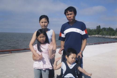 burmese family - K'dah Ra Wah (mother), Shwe La Say (father), Blessing Saw (wheelchair) and daughter Buna Bel- for Lindor Reynolds story winnipeg free press