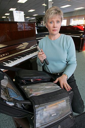 BORIS MINKEVICH / WINNIPEG FREE PRESS  070122 Terri Bessey is a piano tuner that caught some theives trying to get away with her piano tuning tools. Here she poses with some of her tool kit.