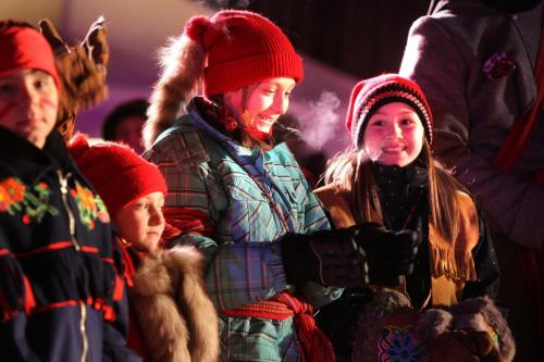 Ten year old Janelle Perrault (right) and her friend Zoe Gauthier - 11yrs  are all smiles as they take part in the opening ceremonies of the 43rd annual Festival du Voyageur Friday night. Don't have the other names. See Alex Paul story. Feb 17, 2012 (Ruth Bonneville / Winnipeg Free Press)