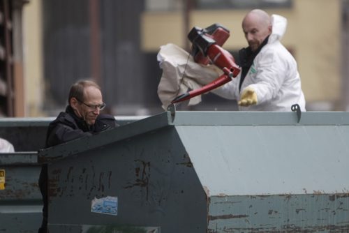 Winnipeg Police search through a large garbage bin in the area of York Avenue near Donald Street, February 20, 2012. Police are investigating what they call "suspicious circumstances." (TREVOR HAGAN/WINNIPEG FREE PRESS) Winnipeg's 5th homicide of 2012.