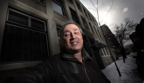 Winnipeg developer Hart Mallin poses in front of his origional Exchange are development that turned a vacant Princess street warehouse into downtown condos. See Murray McNeil's story. February 24 2012. PHIL HOSSACK PHOTO / WINNIPEG FREE PRESS