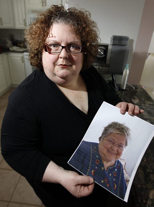 Dana Brenan holds a photo of her mother, Heather Brenan, Friday February 24, 2012. Heather Brenan died after being sent home alone, without keys, from the ER while still sick. She collapsed and was taken back to hospital, where she died. (TREVOR HAGAN/WINNIPEG FREE PRESS) - see carol sanders story