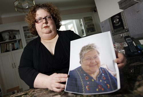 Dana Brenan holds a photo of her mother, Heather Brenan, Friday February 24, 2012. Heather Brenan died after being sent home alone, without keys, from the ER while still sick. She collapsed and was taken back to hospital, where she died. (TREVOR HAGAN/WINNIPEG FREE PRESS) - see carol sanders story