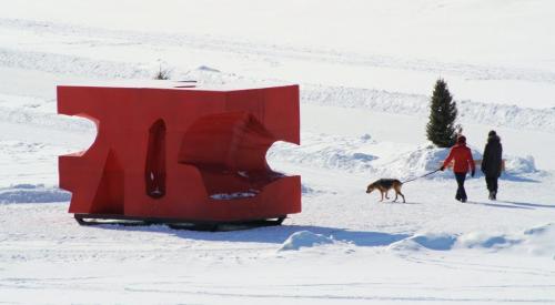 A curious dog tries to check out a warming shelter while on a walk on the Red River Saturday afternoon.  120225 Mike Deal / Winnipeg Free Press