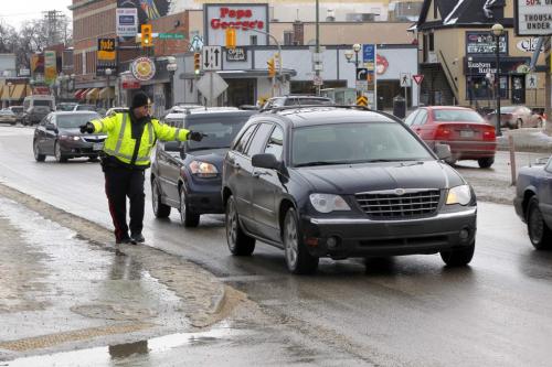 Checking for cell phone offenders. The Winnipeg Police Service set up an operation to enforce the cell phone use while driving laws. One plain clothes cop eye4s people in Osborne Village going northbound and radioed ahead where a few cops would pull the car over and deal with the offense. February 29, 2012  BORIS MINKEVICH / WINNIPEG FREE PRESS