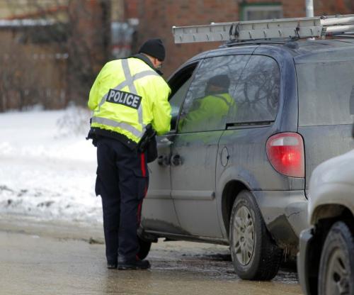Checking for cell phone offenders. The Winnipeg Police Service set up an operation to enforce the cell phone use while driving laws. One plain clothes cop eye4s people in Osborne Village going northbound and radioed ahead where a few cops would pull the car over and deal with the offense. February 29, 2012  BORIS MINKEVICH / WINNIPEG FREE PRESS check