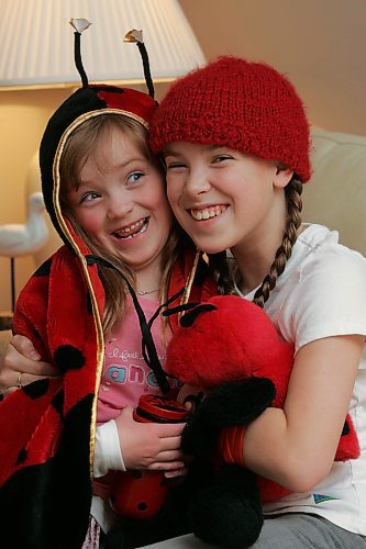 BORIS MINKEVICH / WINNIPEG FREE PRESS 070125 Hannah Taylor and her little sister Gabriella,5, pose for a portrait in her home.