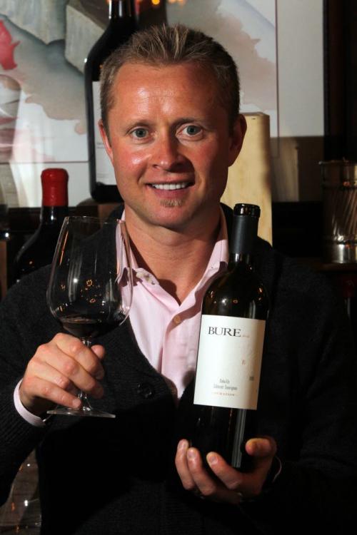 Valeri Bure, former sniper with the Calgary Flames and Florida Panthers, is in town doing some promotional work with his wine company, Bure Family Wines in California poses for a photo at 529 Wellington restaurant with some of his wine.  March 2, 2012  BORIS MINKEVICH / WINNIPEG FREE PRESS