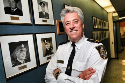 Police Chief Keith McCaskill stands in the hall outside his office along which portraits of previous Winnipeg Chiefs hang. His father K. N. McCaskill (botton left) was Chief Constable St. James-Assiniboia during the amalgamation period from 1970-74. Chief Keith McCaskill has decided to retire from the Winnipeg Police Service at the completion of his contract which expires on December 9th, 2012. 120302 March 02, 2012 Mike Deal / Winnipeg Free Press