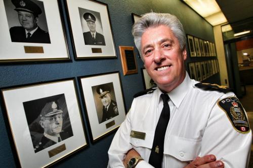 Police Chief Keith McCaskill stands in the hall outside his office along which portraits of previous Winnipeg Chiefs hang. His father K. N. McCaskill (botton left) was Chief Constable St. James-Assiniboia during the amalgamation period from 1970-74. Chief Keith McCaskill has decided to retire from the Winnipeg Police Service at the completion of his contract which expires on December 9th, 2012. 120302 March 02, 2012 Mike Deal / Winnipeg Free Press