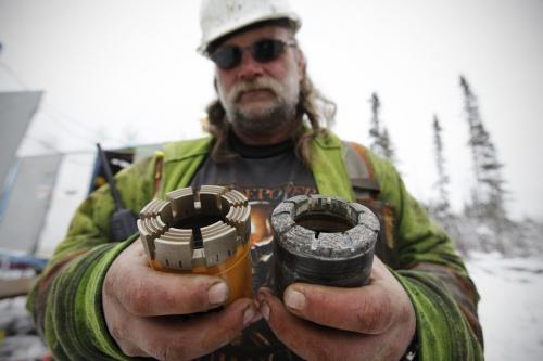 February 24, 2012 - 120224  -  Andrew Cann, field supervisor for Rodren Drilling, compares a new diamond bit to a used one at the Ogama-Rockland Project for Bison Gold Resources Friday February 24, 2012.   John Woods / Winnipeg Free Press