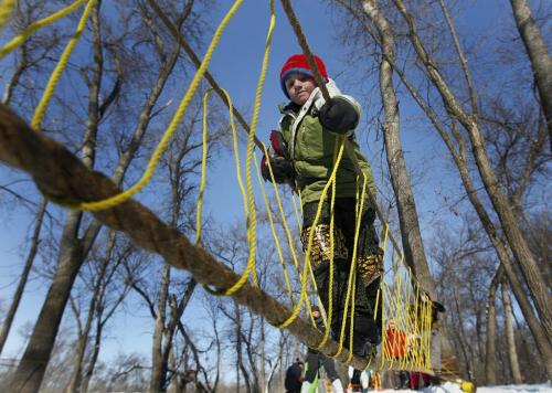 March 4, 2012 - 120304  -  Alex Hentelef of the 82nd Westminster Cub group crosses the rope bridge in the 40th annual Klondike Derby at Camp Amisk Sunday March 4, 2012.    John Woods / Winnipeg Free Press