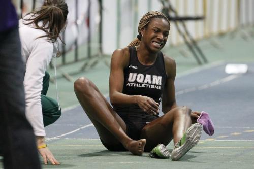 Kimberly Hyacinthe of team UQAM grimaces from a toe injury after winning the Women's 60m at the 2012 CIS Track and Field Championship in Winnipeg on Thursday, March 8, 2012. (John Woods / Winnipeg Free Press)