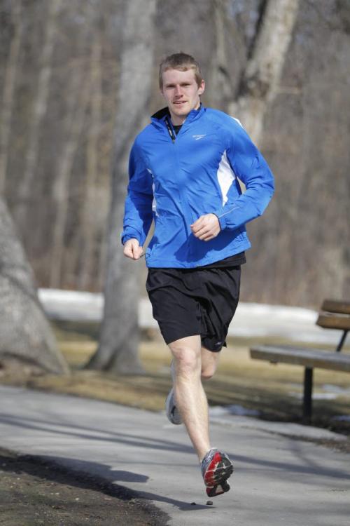Corey Gallagher, marathon running champ, runs around the duck pond at St. Vital Park. Shamona Harnett story. March 14, 2012  BORIS MINKEVICH / WINNIPEG FREE PRESS