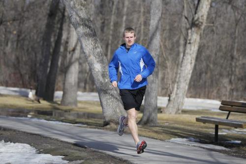 Corey Gallagher, marathon running champ, runs around the duck pond at St. Vital Park. Shamona Harnett story. March 14, 2012  BORIS MINKEVICH / WINNIPEG FREE PRESS