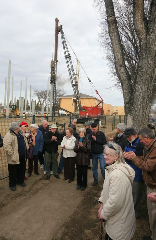 Brandon Sun Janet Brown, a member of the Westman Seniors Non Profit Housing Co-op, right, speaks to a gathering of future residents of the new housing project being built on McDiarmid Drive on Thursday morning. (Bruce Bumstead/Brandon Sun)