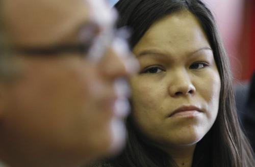 John Woods / Winnipeg Free Press / January 29/07 - 070129  - Jessica Paul, the sister of Matthew Dumas who was shot by a Winnipeg police officer, listens to her lawyer Norman Boudreau at a press conference Monday January 29th where she announced that she is launching a law suite against her brother's  killer, Constable Richard Roe, Chief Jack Ewatski, and the City of Winnipeg.   Also in attendance at the conference is Southern Grand Chief Chris Henderson.