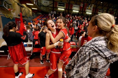 Glenlawn Collegiate's basketball team's  #10 Emily Potter (left)  embraces #20 Laura McManes after their team won the High School semifinal game against the Westwood Warriors Thursday night at Duckworth Centre. March 15  2012 (Ruth Bonneville/Winnipeg Free Press)