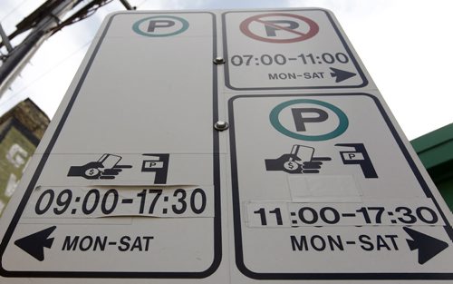Rick Scanlan finds the parking signage on Alexander between Lily and Waterfront to be very confusing. The signs appear to display conficting information, March 16, 2012. (TREVOR HAGAN/WINNIPEG FREE PRESS) - see gord sinclair story